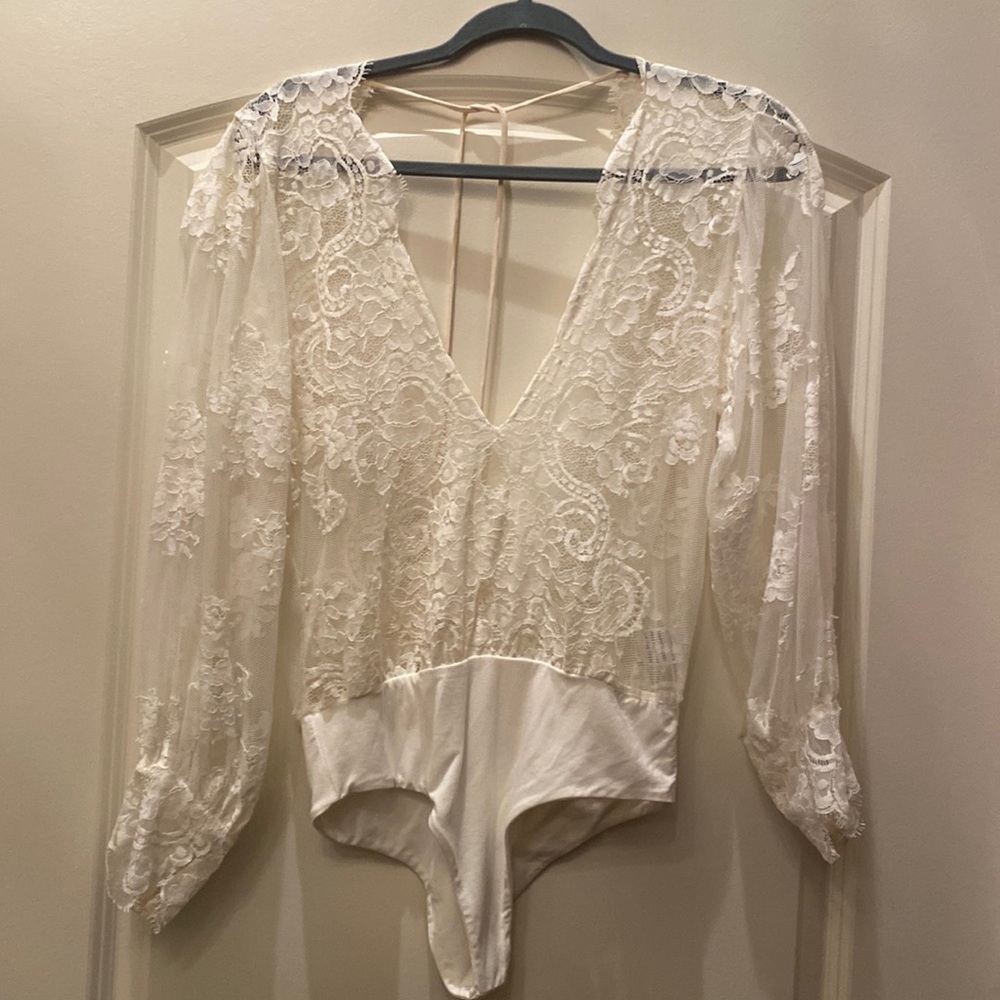 Jen’s pirate booty white lace bodysuit